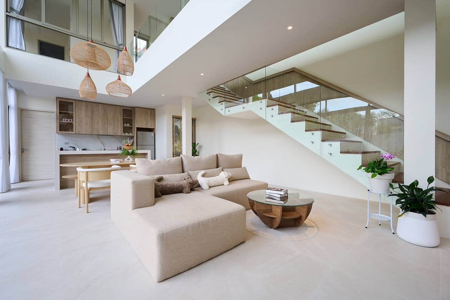 Villa Belcasa private pool and outdoor lounge with the villa's glass facade behind