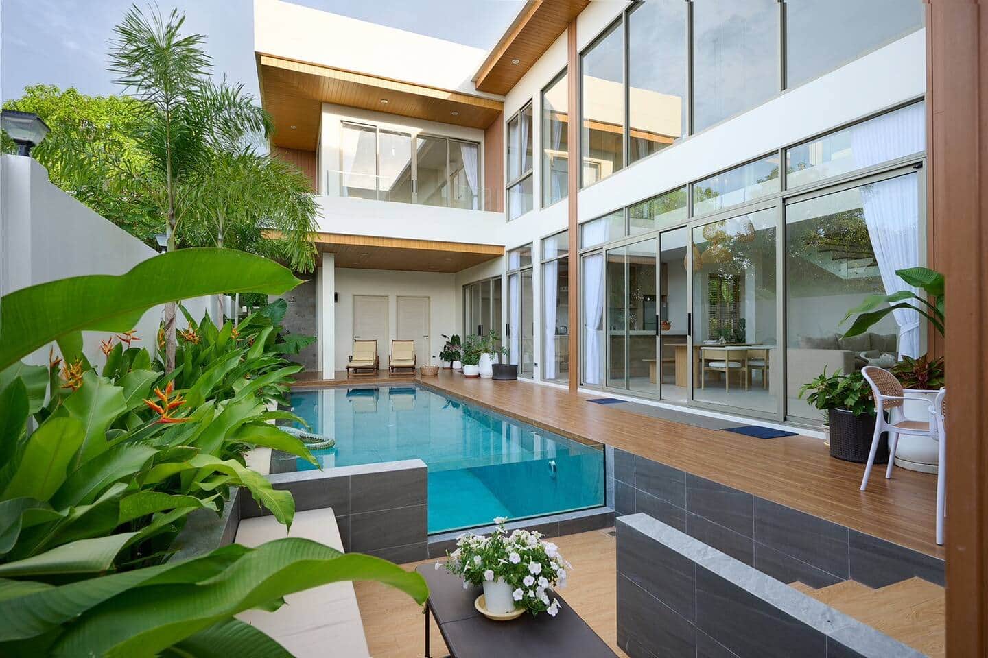 Villa Belcasa's two-storey glass facade over the private pool