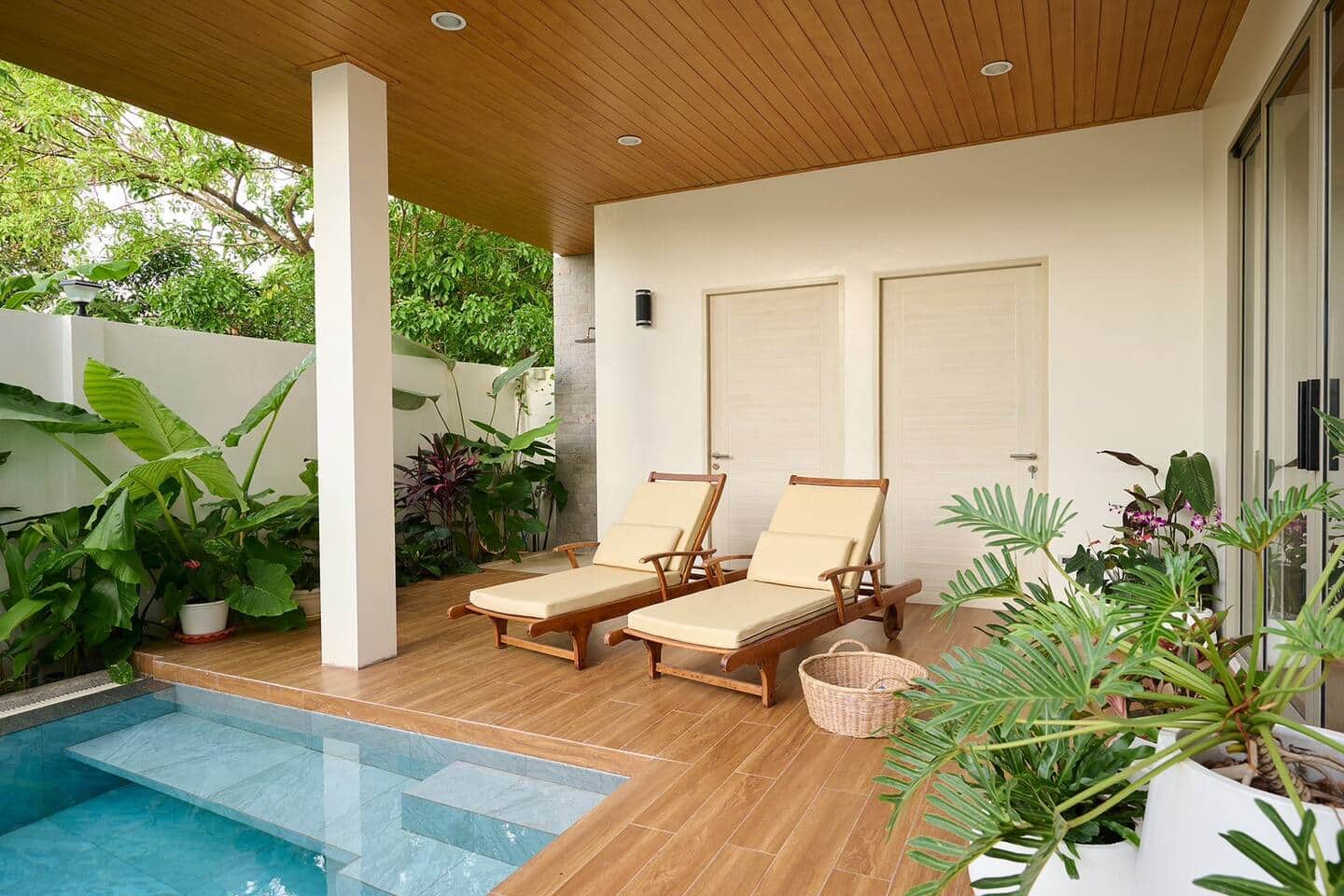 Terrace loungers beside the pool at Villa Belcasa