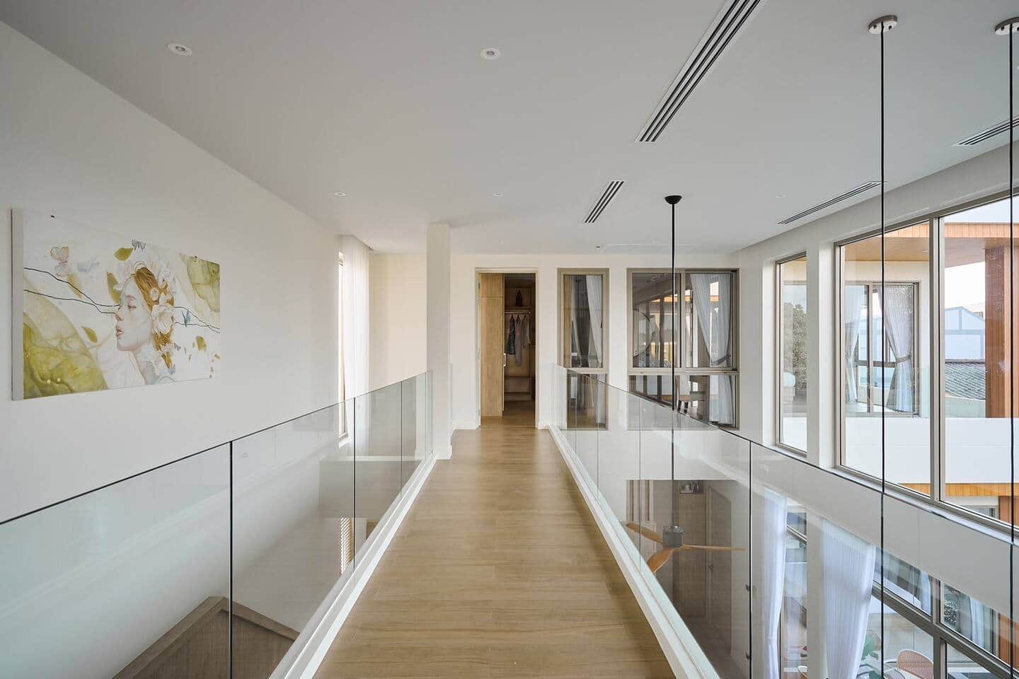 Warm wood corridor inside Villa Belcasa