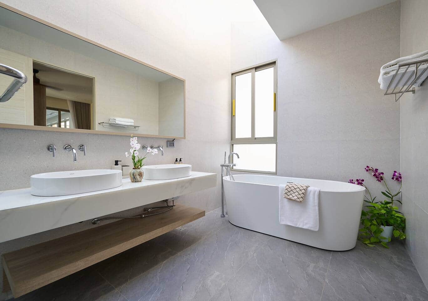 Master bathroom with freestanding tub and double vanity at Villa Belcasa