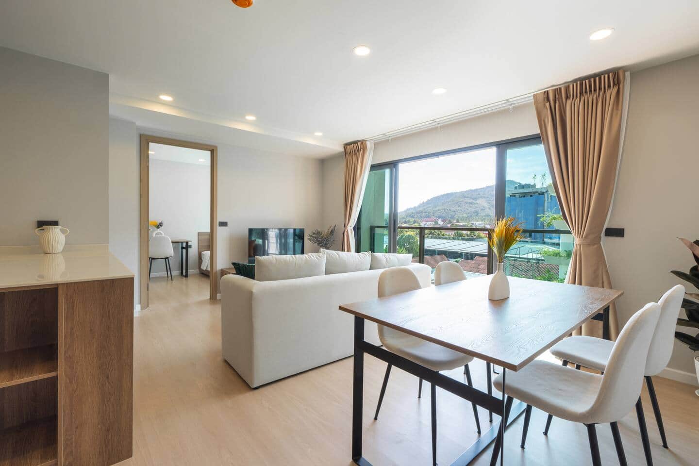 Bedroom with work desk and city outlook