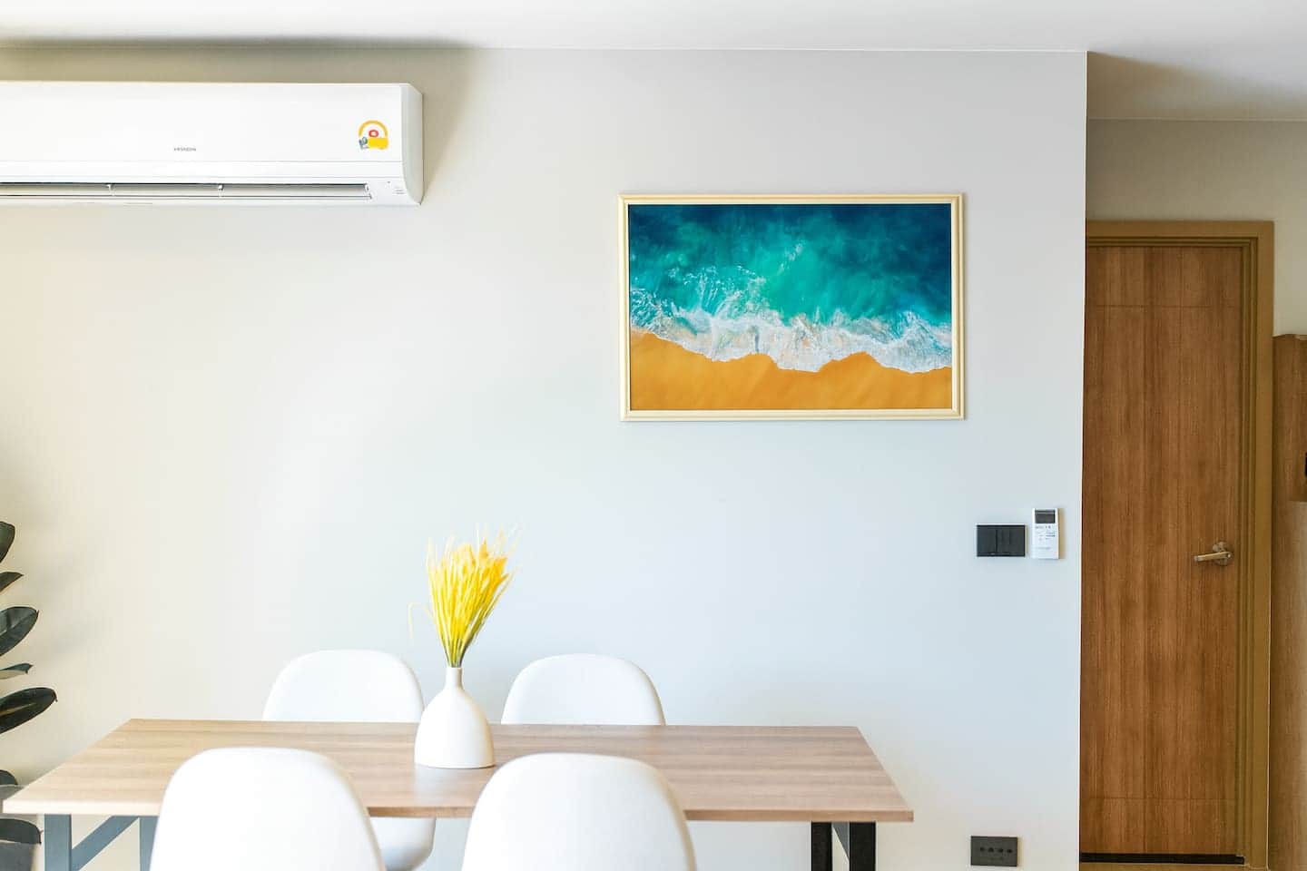 Dining nook with seaside artwork at Bella Space