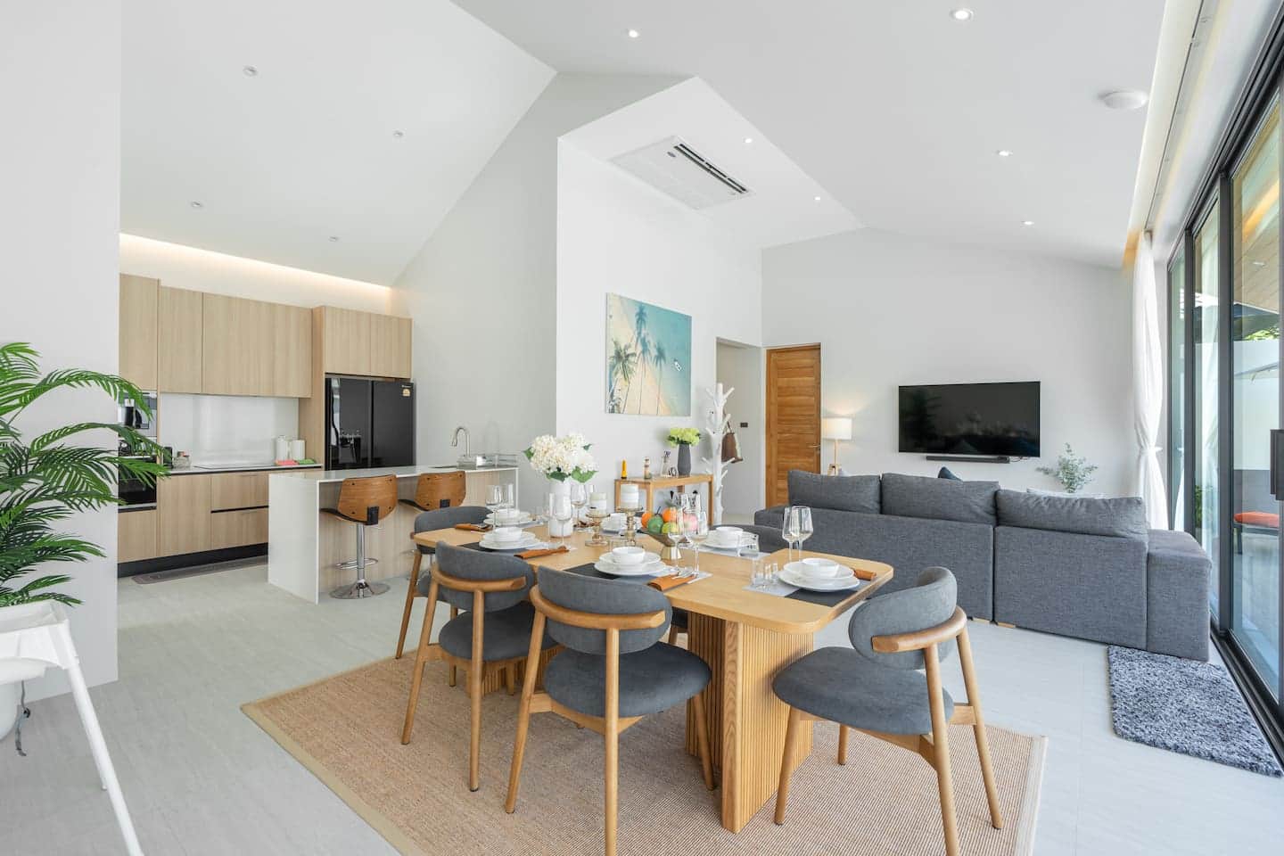 Open-plan living and dining under the vaulted ceiling