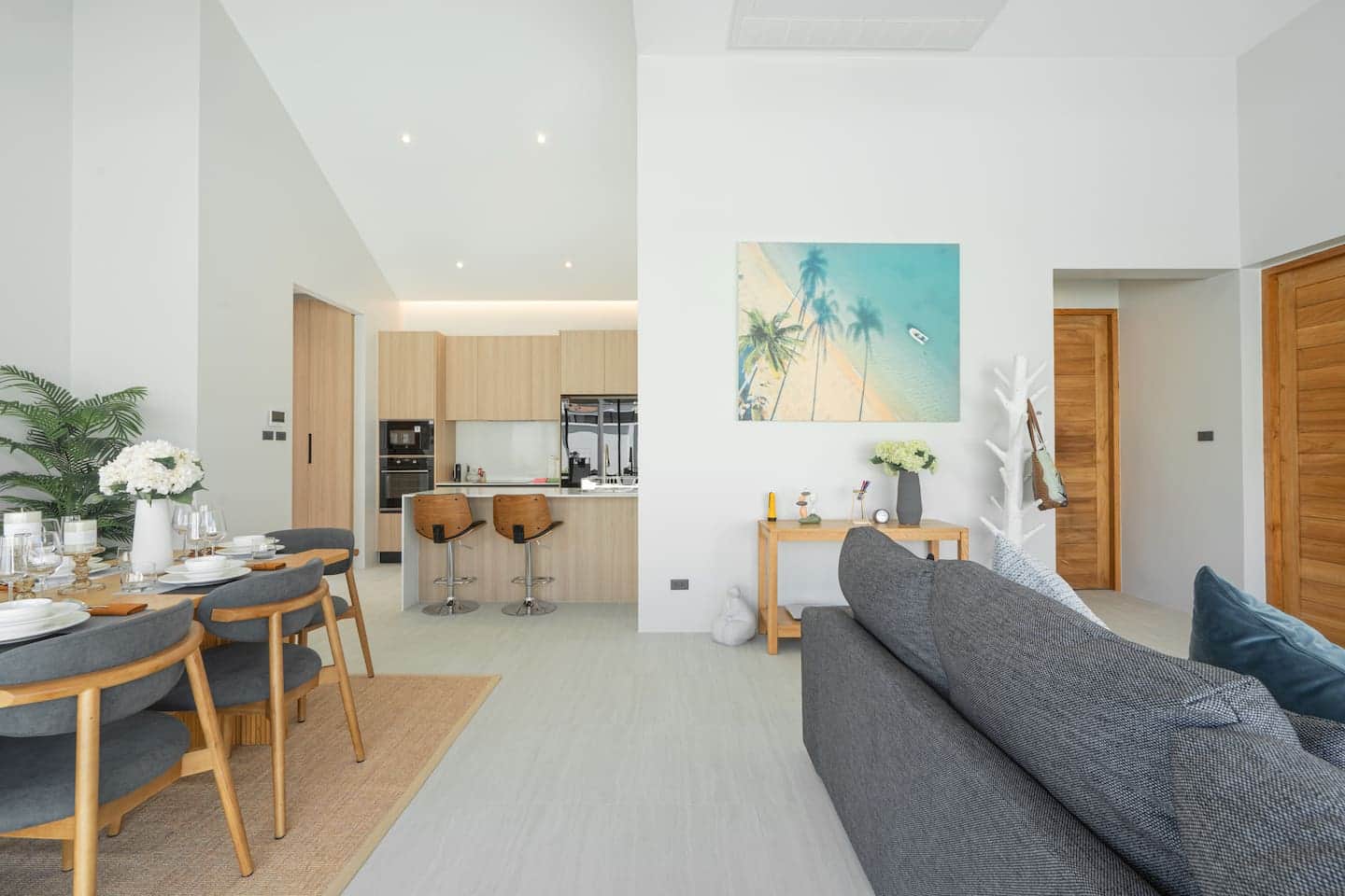 Dining table and lounge in coastal tones