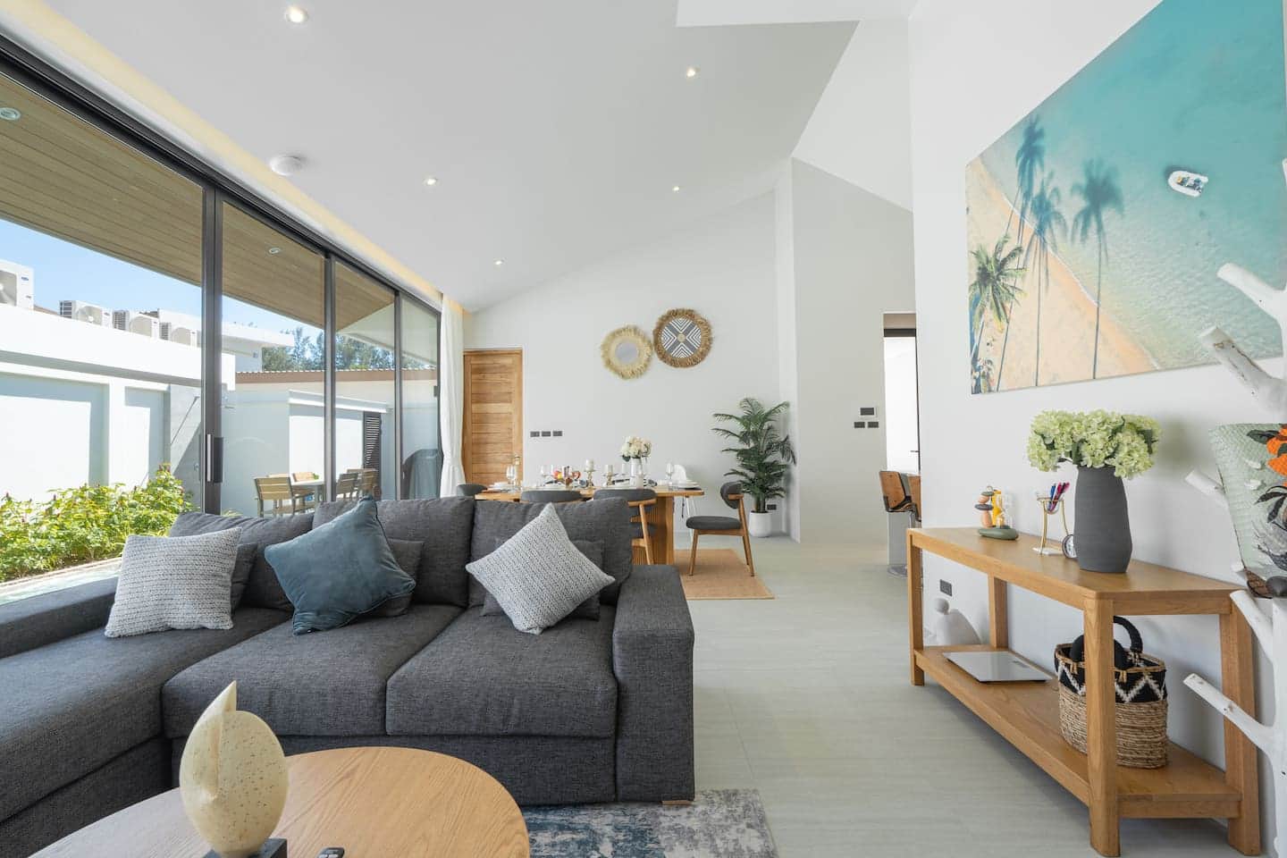 Living room with palm artwork at Villa Belplaya