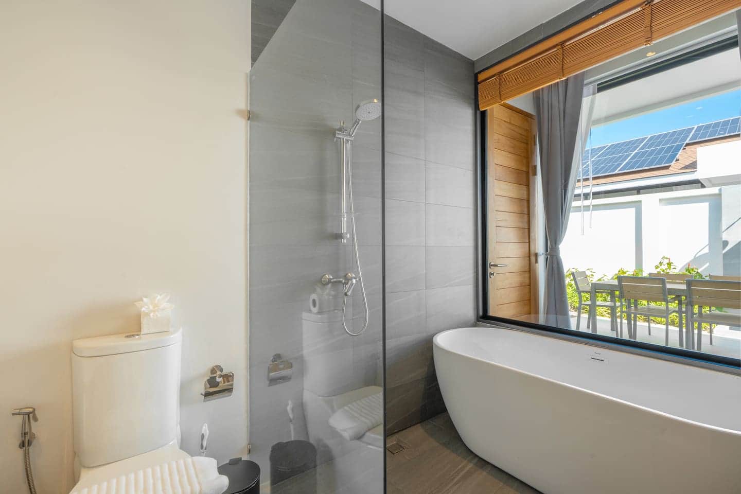 Bathroom with bathtub and picture window