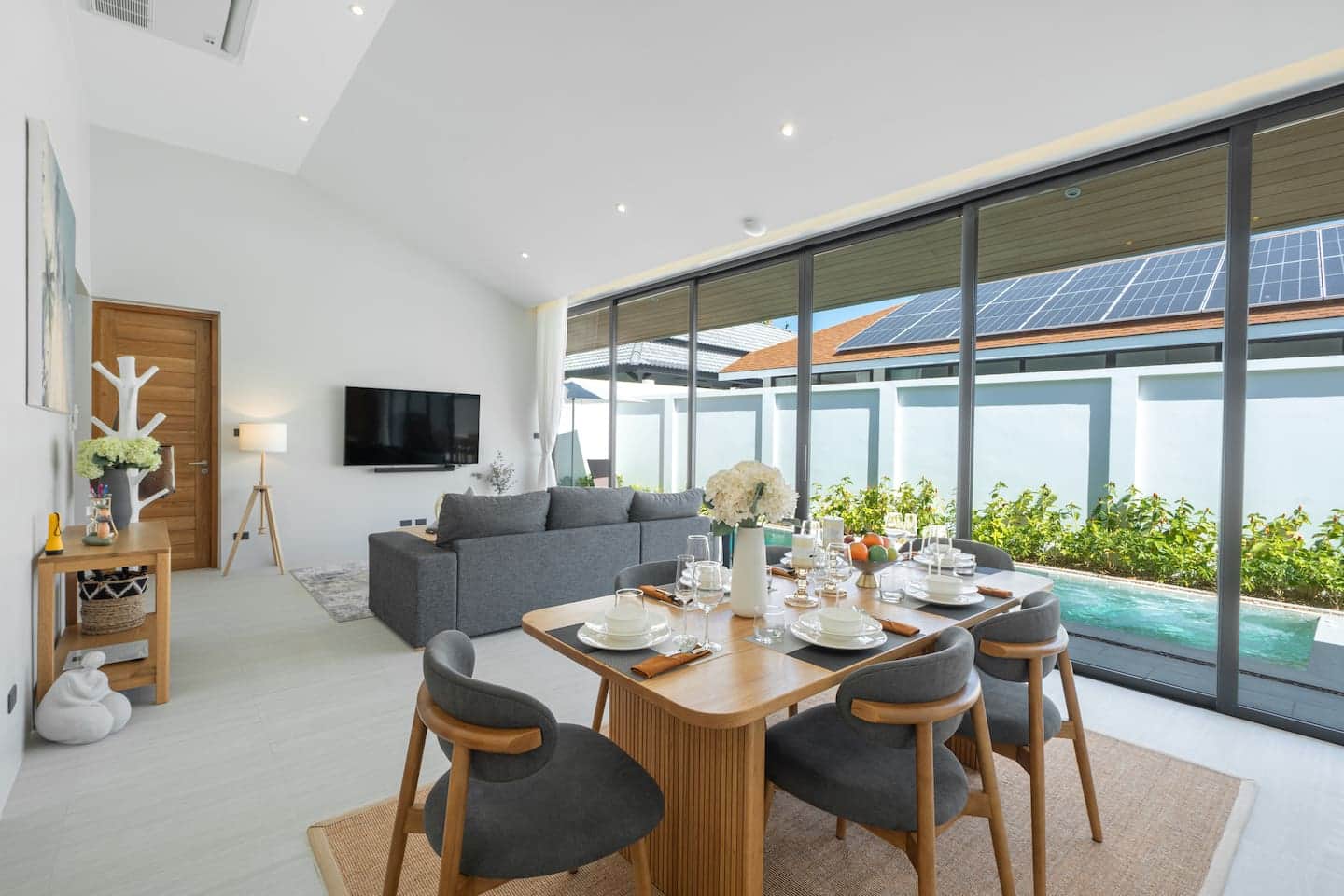 Living and dining with pool view at Villa Belplaya