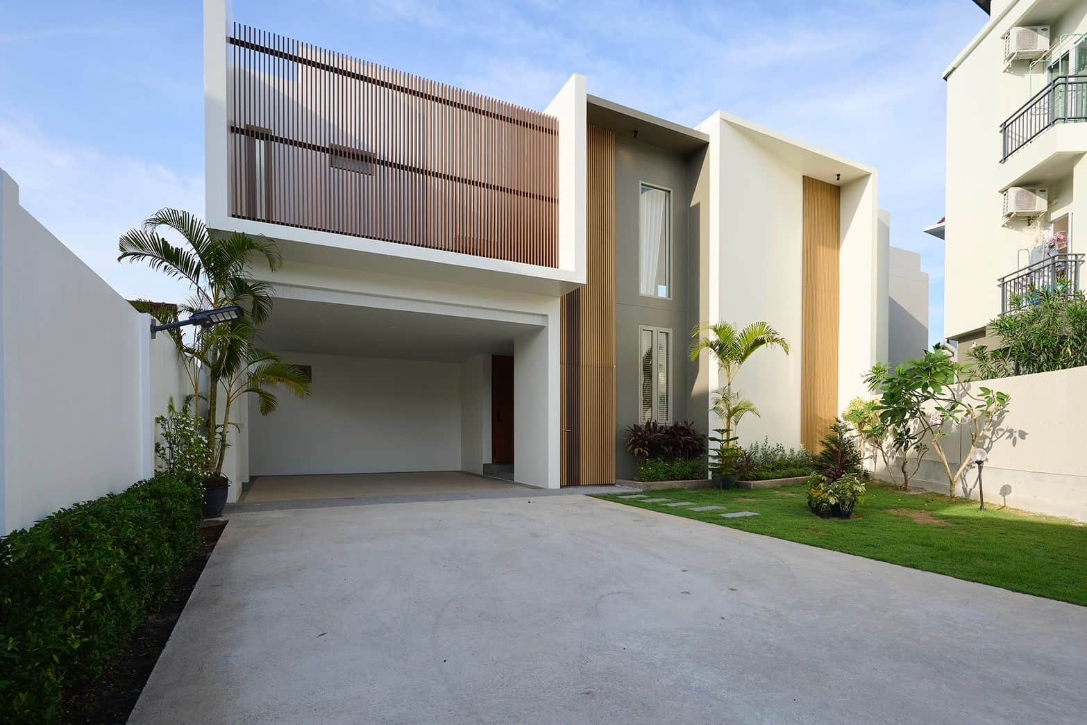 Modern villa exterior with gated driveway in Cherngtalay